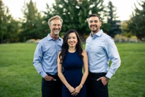left to right: Dr. Kevin, Dr. Kat, and Dr. Philip are smiling for a photo in Reno, nevada