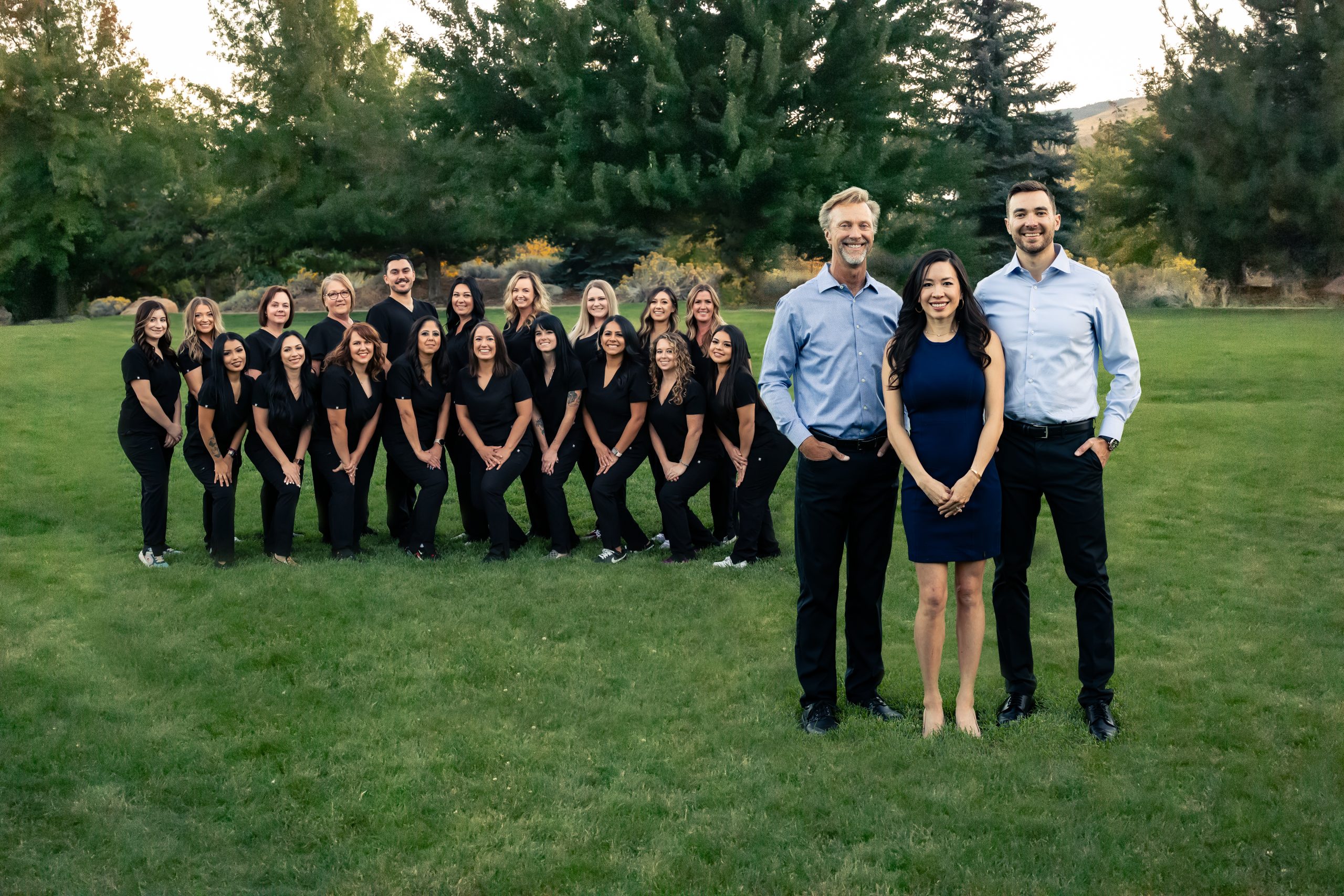 The Andrews Braces team is smiling for a group photo with Dr. Kevin, Dr. Kat and Dr. Philip (left to right) in front